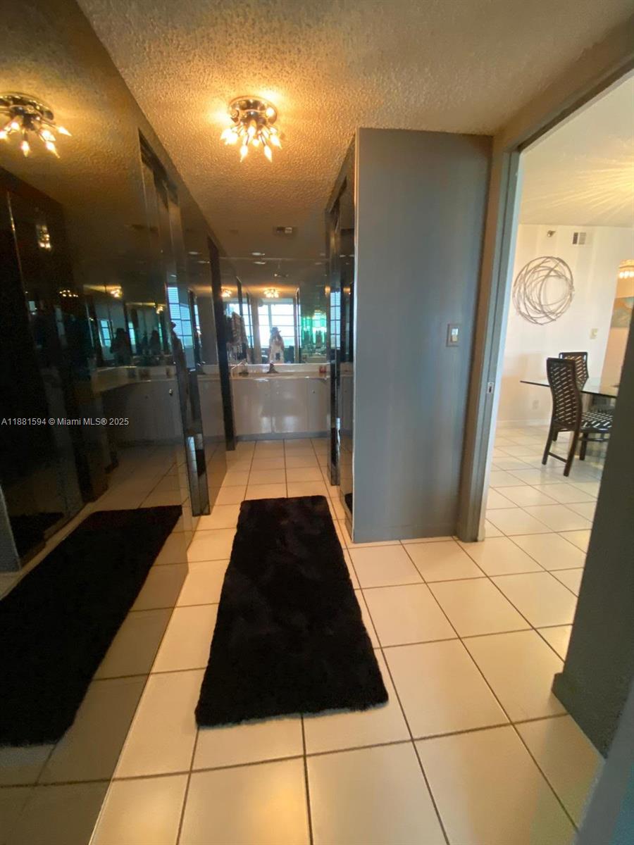 3507 Oaks Way, Unit 804 Pompano Beach, FL 33069 - Photo 11 of 26 a view of entryway with a rug
