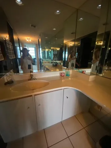 a kitchen with a sink and a stove top oven
