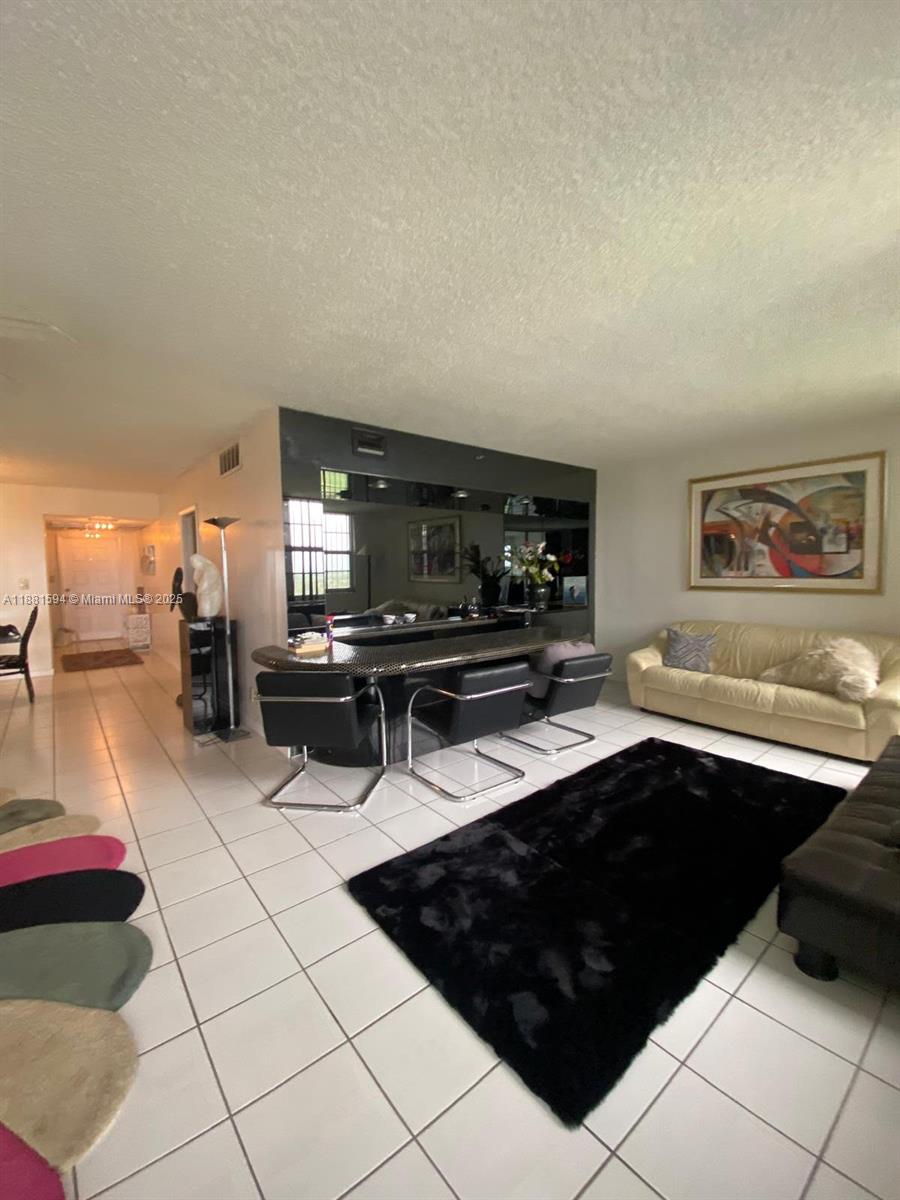 3507 Oaks Way, Unit 804 Pompano Beach, FL 33069 - Photo 16 of 26 a kitchen with a sink and a stove top oven