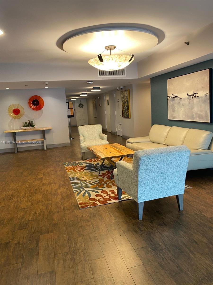 3507 Oaks Way, Unit 804 Pompano Beach, FL 33069 - Photo 24 of 26 a bed room with a bed and window