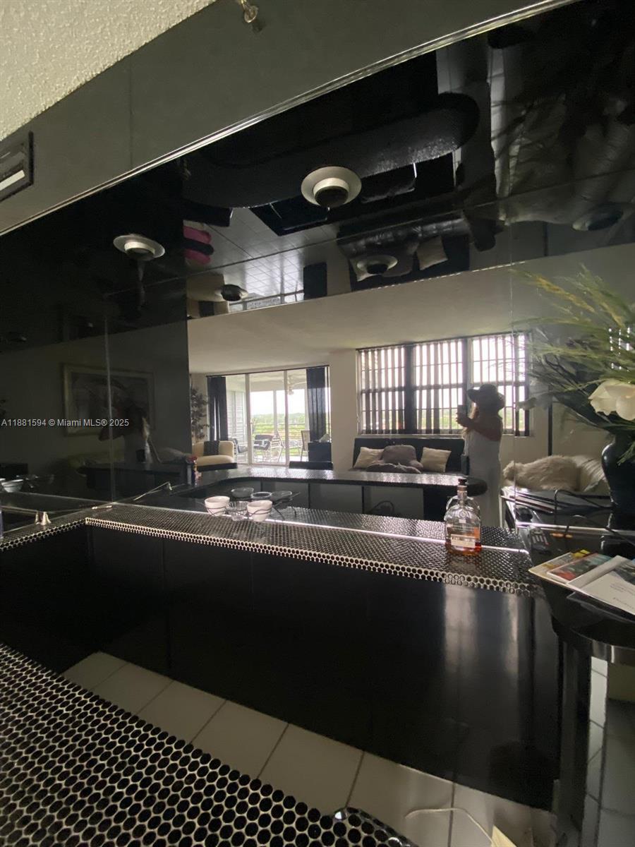 3507 Oaks Way, Unit 804 Pompano Beach, FL 33069 - Photo 3 of 26 a kitchen with lots of counter top space