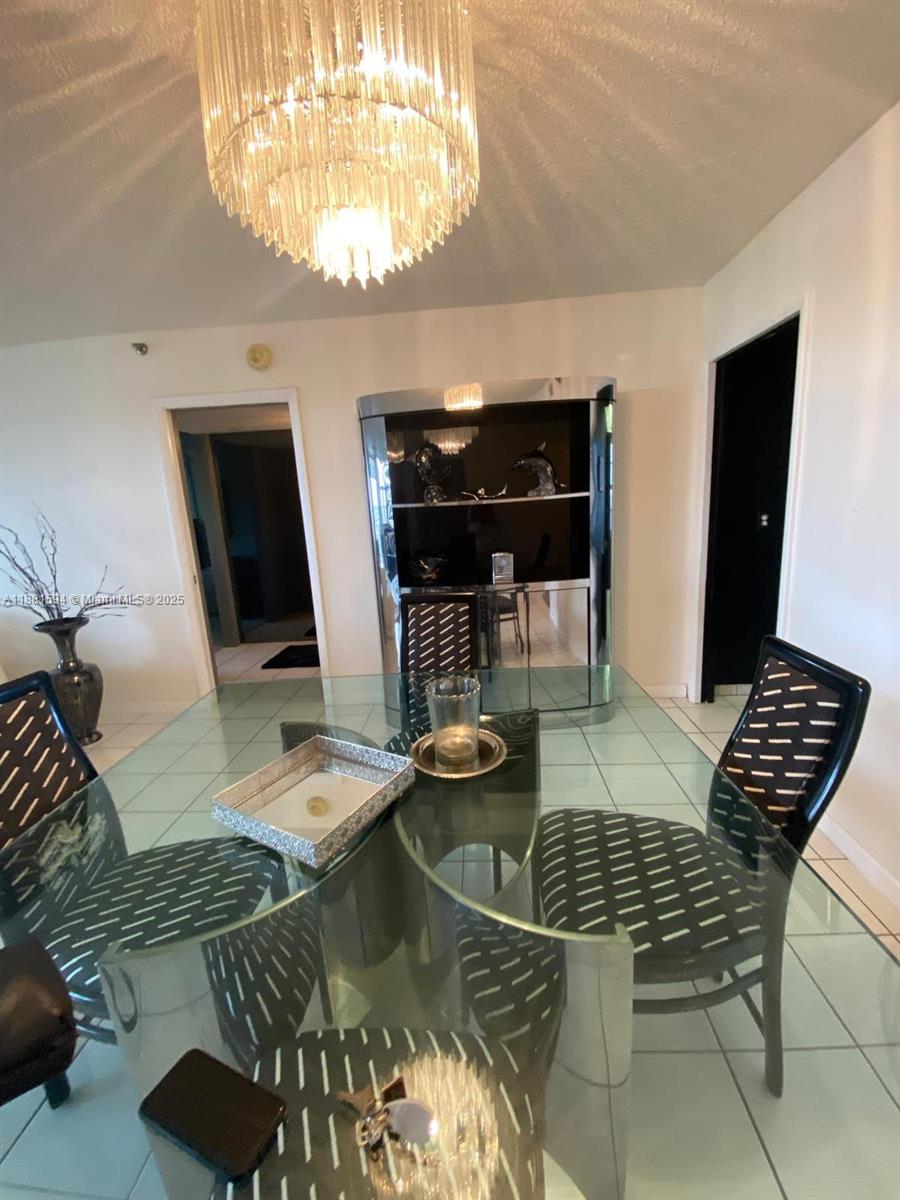 3507 Oaks Way, Unit 804 Pompano Beach, FL 33069 - Photo 6 of 26 a view of a dining room with furniture