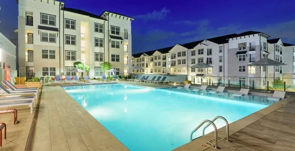 6255 Riverview Road Southeast, Unit 2417 Mableton, GA 30126 - Photo 8 of 16 a view of building with swimming pool and patio