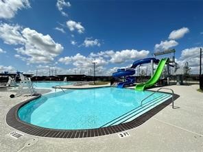 206 John House Lane Rosharon, TX 77583 - Photo 13 of 15 a view of a swimming pool with a yard and plants