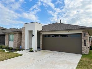 206 John House Lane Rosharon, TX 77583 - Photo 2 of 15 a front view of a house with a garage