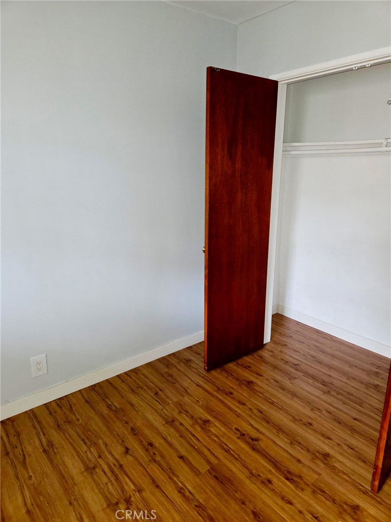 410 West Magnolia Street, Unit 2 Compton, CA 90220 - Photo 3 of 4 a view of an empty room with wooden floor