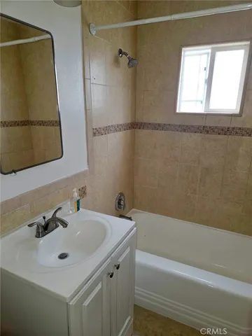 a bathroom with a sink and a bathtub