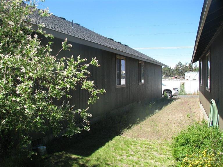 63323 Vogt Road Bend, OR 97701 - Photo 9 of 18 a front view of a house with a yard