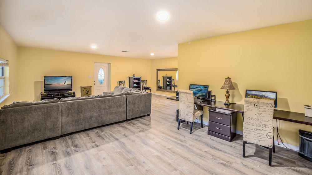 4211 Mustang Road Melbourne, FL 32934 - Photo 14 of 61 050_living_room_view_iii