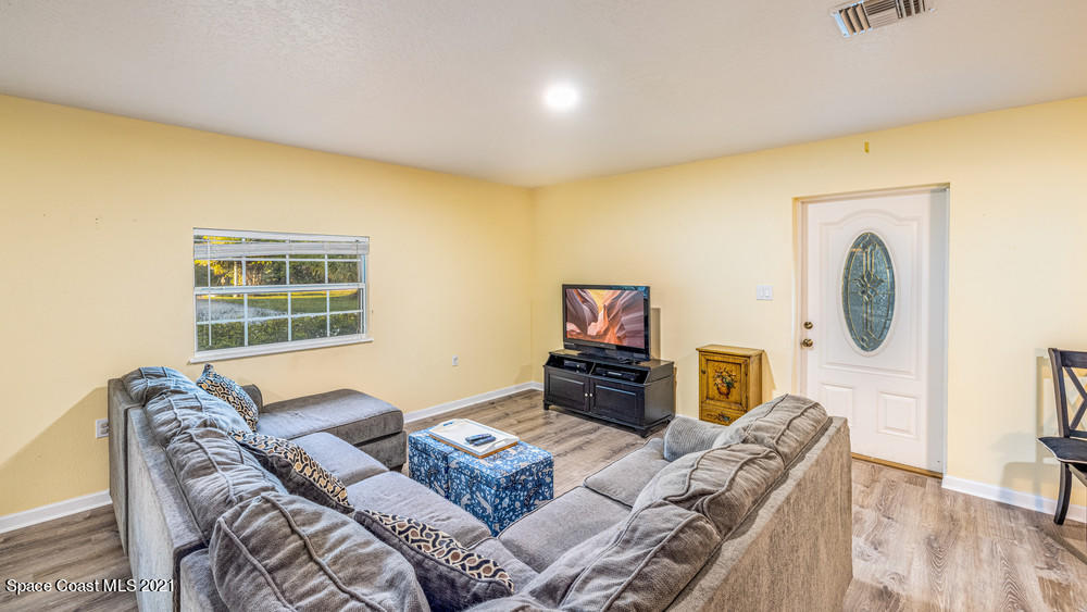 4211 Mustang Road Melbourne, FL 32934 - Photo 17 of 61 049_living_room_view_ii