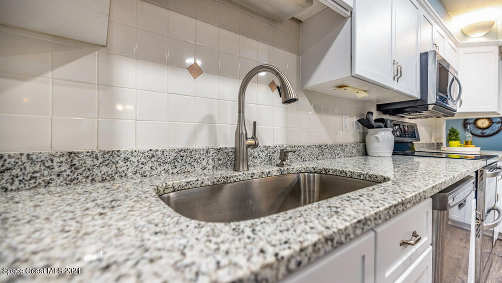 4211 Mustang Road Melbourne, FL 32934 - Photo 23 of 61 046_kitchen_view_iv