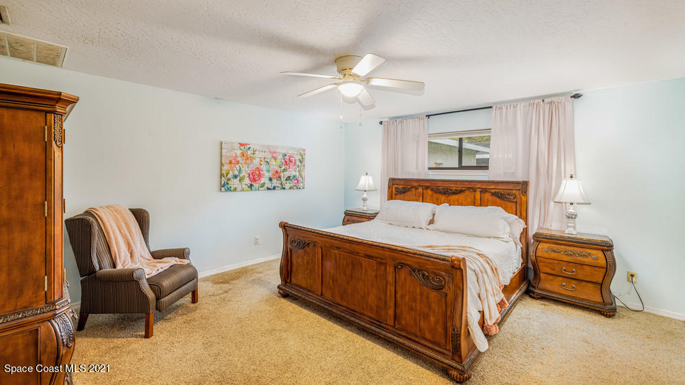 4211 Mustang Road Melbourne, FL 32934 - Photo 27 of 61 056_master_bedroom_view_i