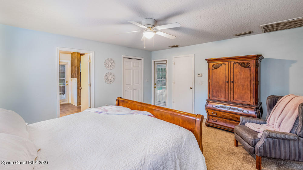 4211 Mustang Road Melbourne, FL 32934 - Photo 28 of 61 057_master_bedroom_view_ii