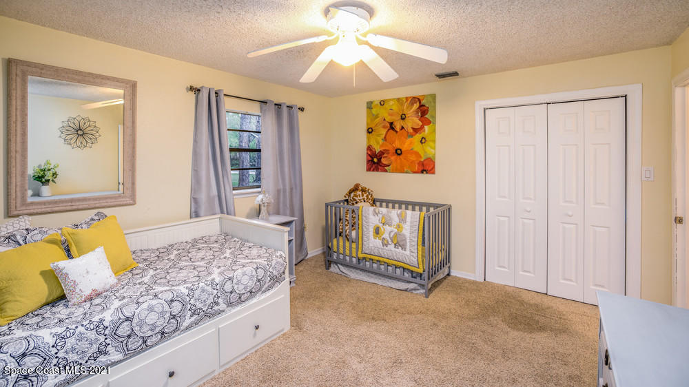 4211 Mustang Road Melbourne, FL 32934 - Photo 39 of 61 024_bedroom_ii_view_ii