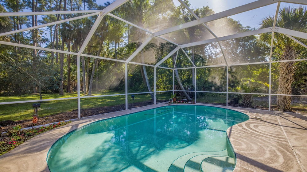 4211 Mustang Road Melbourne, FL 32934 - Photo 45 of 61 058_pool_view_i