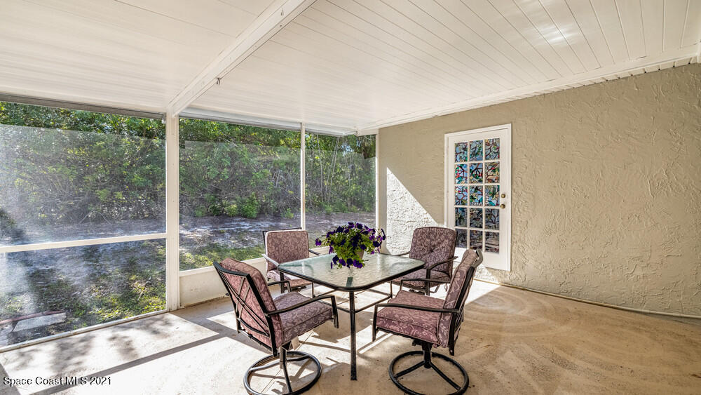 4211 Mustang Road Melbourne, FL 32934 - Photo 52 of 61 017_back_patio_view_v