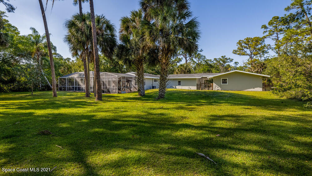 4211 Mustang Road Melbourne, FL 32934 - Photo 57 of 61 019_back_yard_view_i