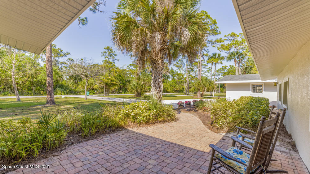 4211 Mustang Road Melbourne, FL 32934 - Photo 9 of 61 007_front_porch_view_ii