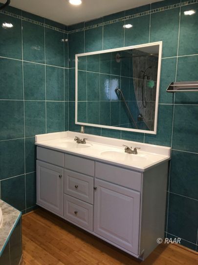 224 West Rader Avenue Ridgecrest, CA 93555 - Photo 16 of 26 a bathroom with a sink and a mirror