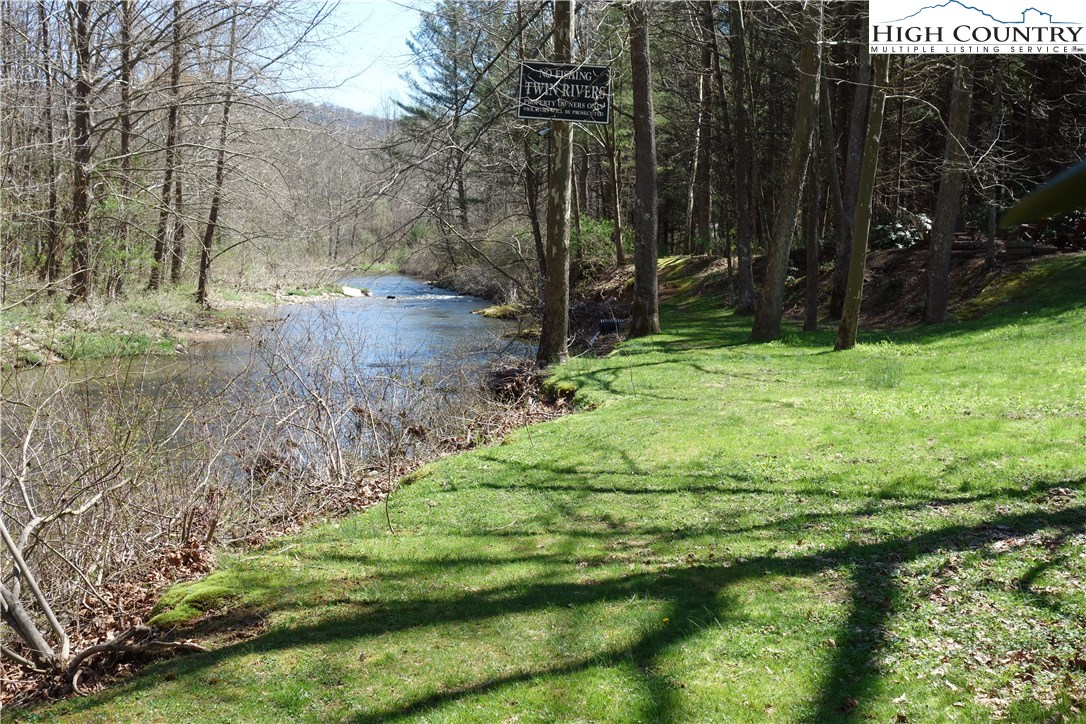 Lot 6 Twin Rivers Drive Boone, NC 28607 - Photo 19 of 20 a backyard of a house with lots of green space
