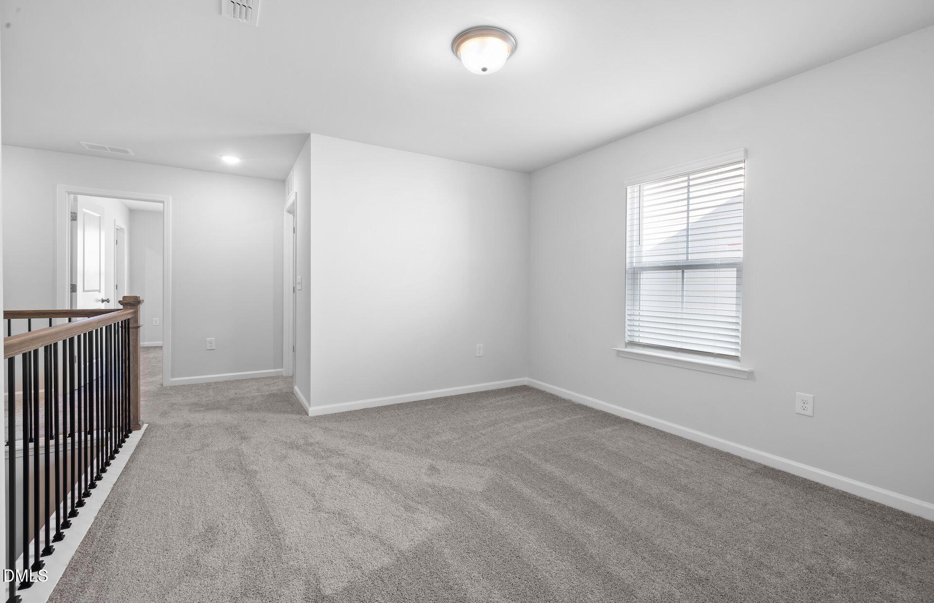 437 Grange Farm Place Raleigh, NC 27603 - Photo 16 of 34 a view of an empty room with a window