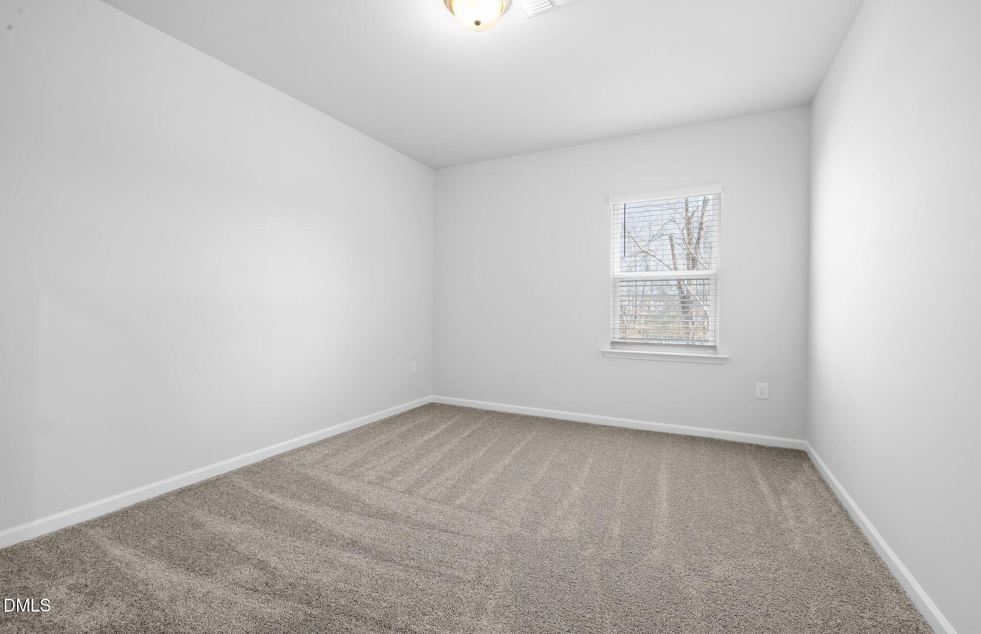437 Grange Farm Place Raleigh, NC 27603 - Photo 17 of 34 an empty room with windows