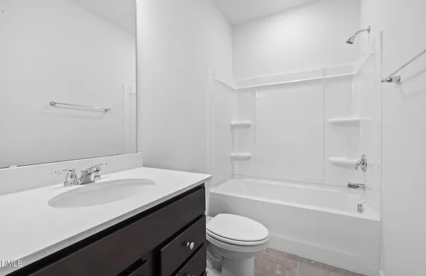 a bathroom with a sink a toilet and a bathtub