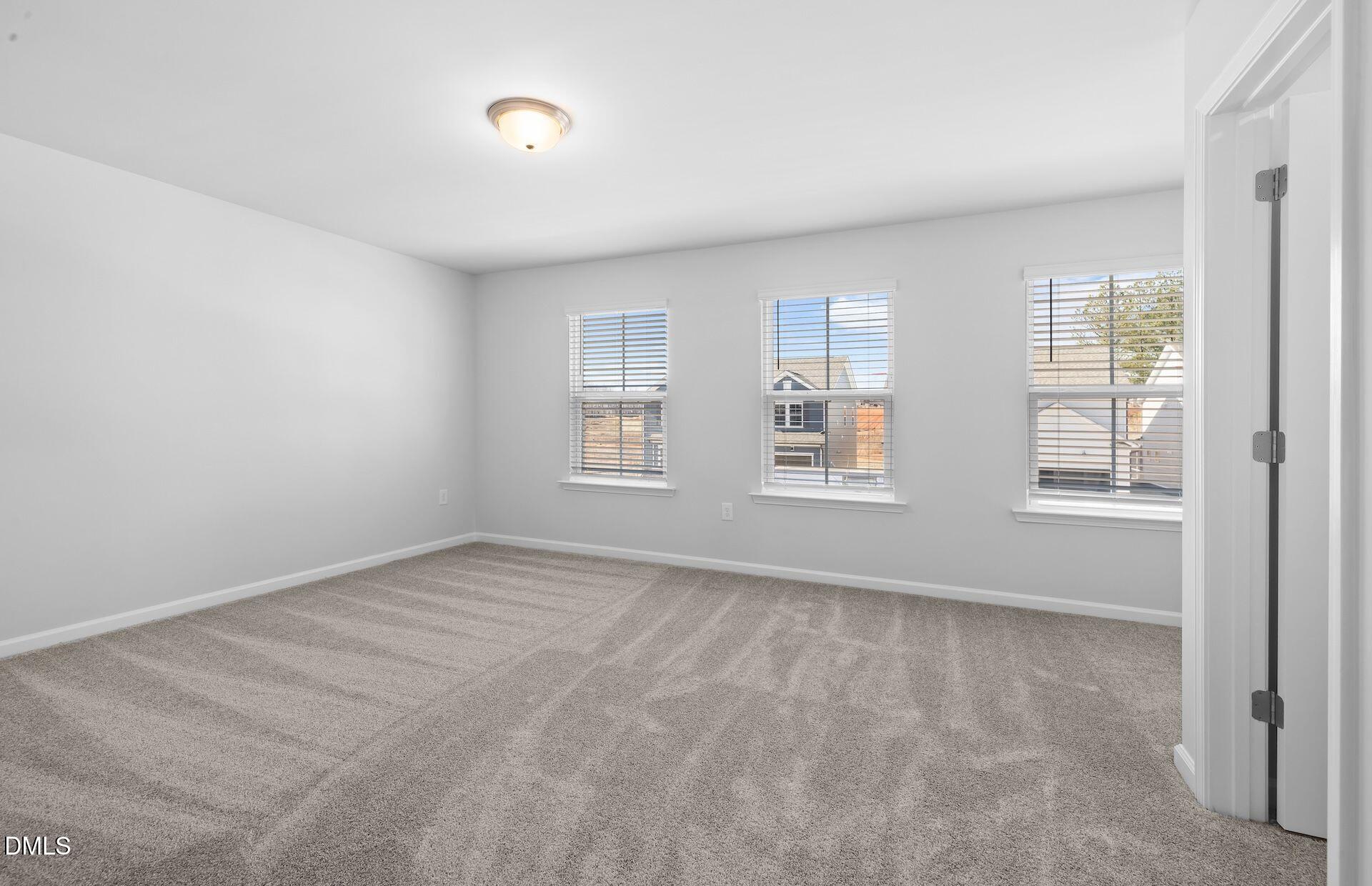 437 Grange Farm Place Raleigh, NC 27603 - Photo 19 of 34 an empty room with windows