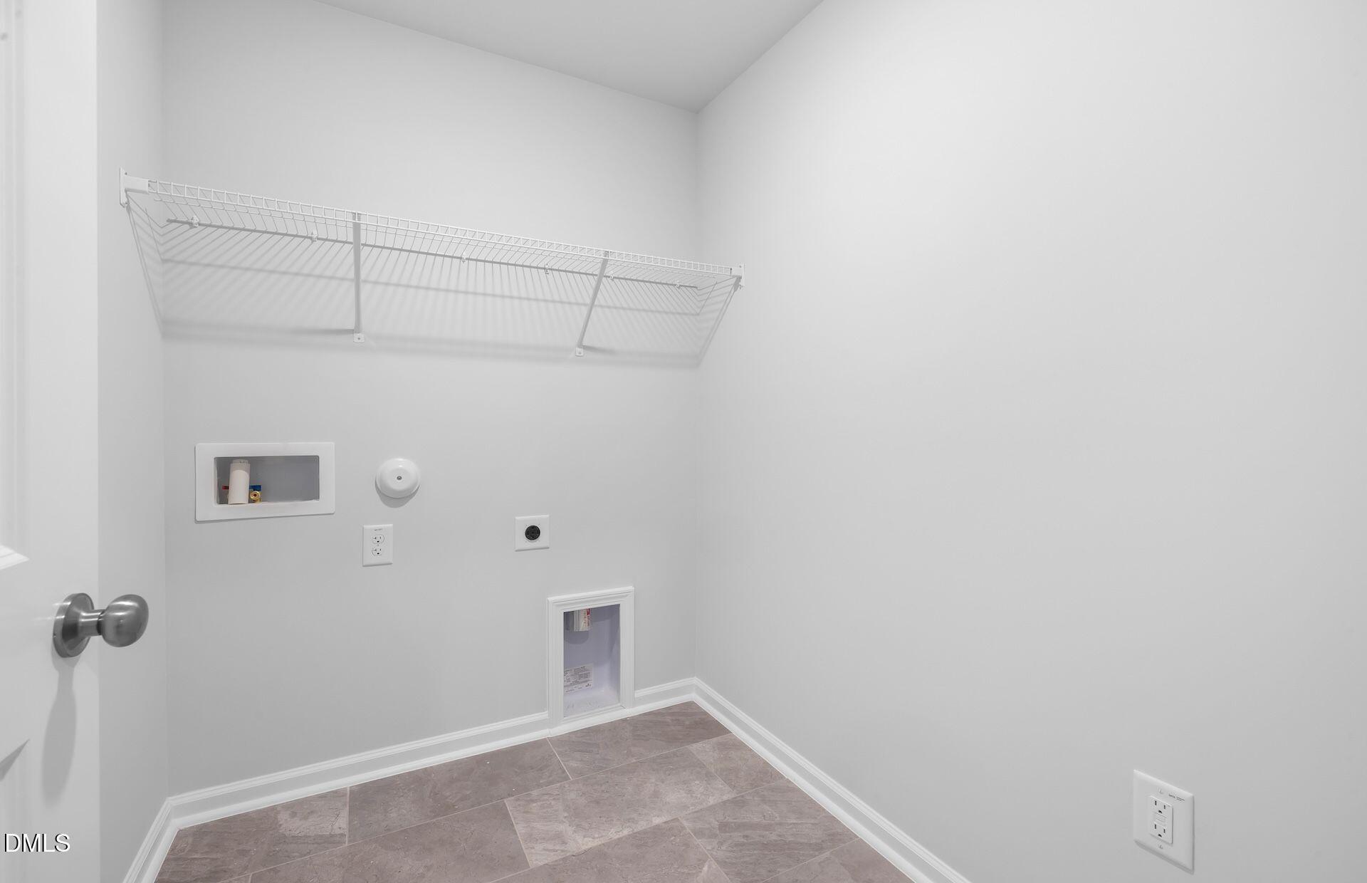 437 Grange Farm Place Raleigh, NC 27603 - Photo 23 of 34 a view of a room with racks on the wall