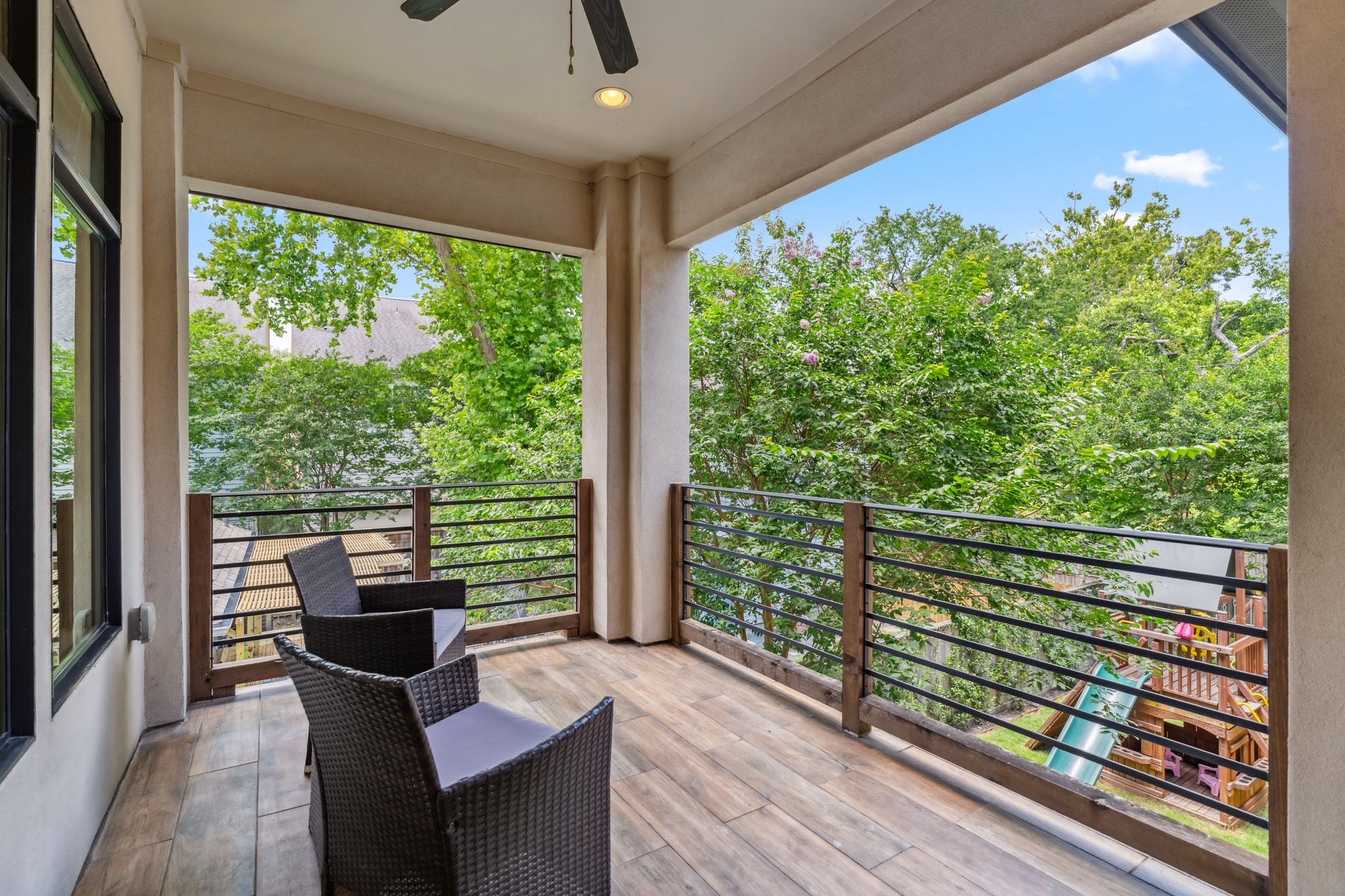 815 East 27th Street Houston, TX 77009 - Photo 20 of 44 Step outside to your private balcony—complete with a fan and recessed can lights—creates a perfect retreat for enjoying morning coffee or evening wine. There's plenty of space for outdoor furniture, making it an ideal spot for relaxation.