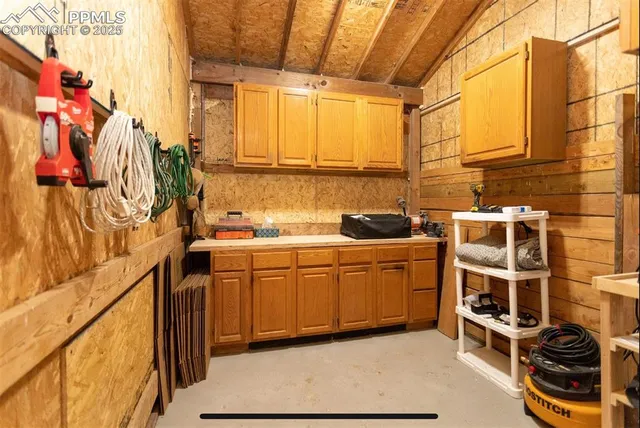 a kitchen with a sink and a stove top oven
