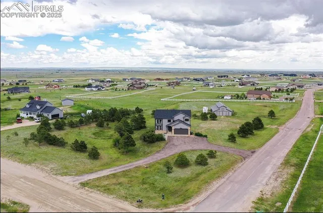 a view of a garden with an outdoor seating