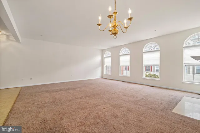 a living room with a fireplace and a window