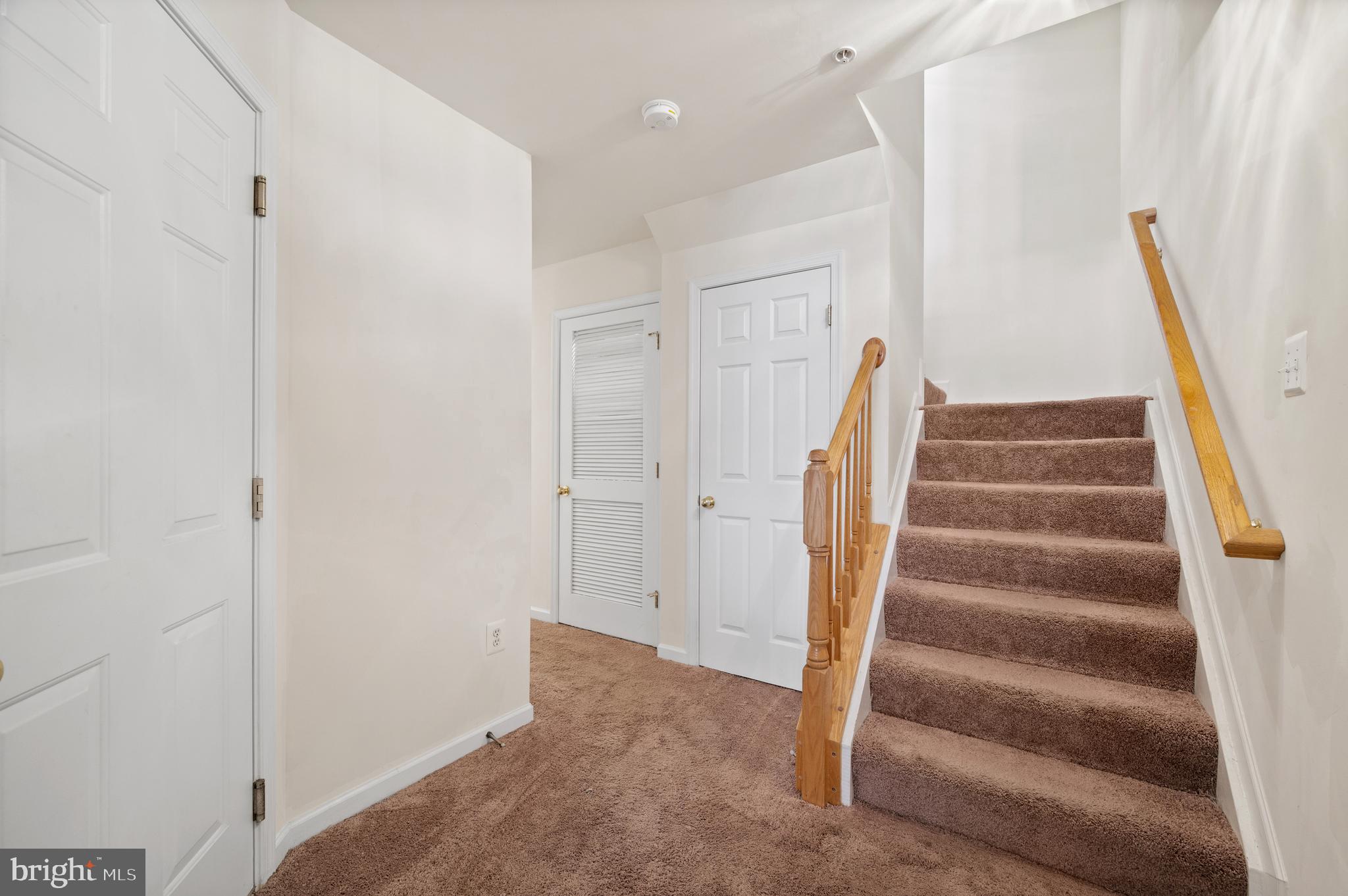 7122 Silverleaf Oak Road, Unit 227 Elkridge, MD 21075 - Photo 19 of 55 a view of staircase with white walls