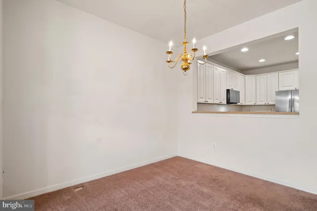 a kitchen with a sink cabinets and window