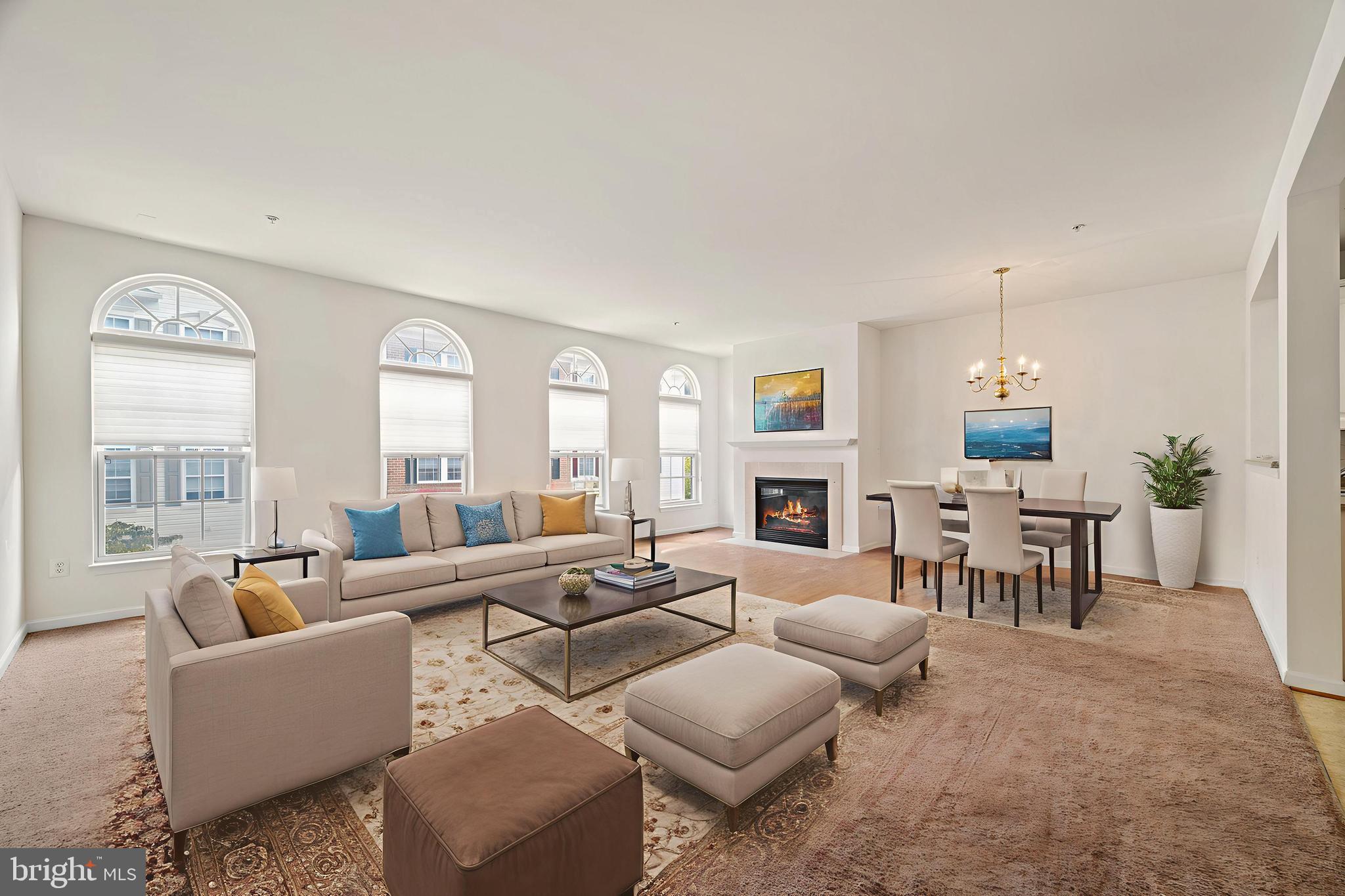 7122 Silverleaf Oak Road, Unit 227 Elkridge, MD 21075 - Photo 2 of 55 a living room with furniture and a large window