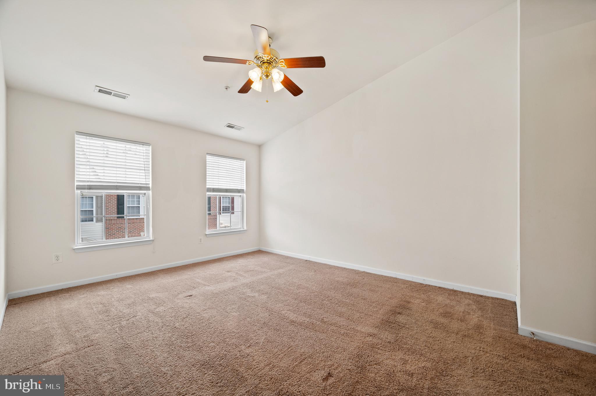 7122 Silverleaf Oak Road, Unit 227 Elkridge, MD 21075 - Photo 25 of 55 an empty room with windows and fan