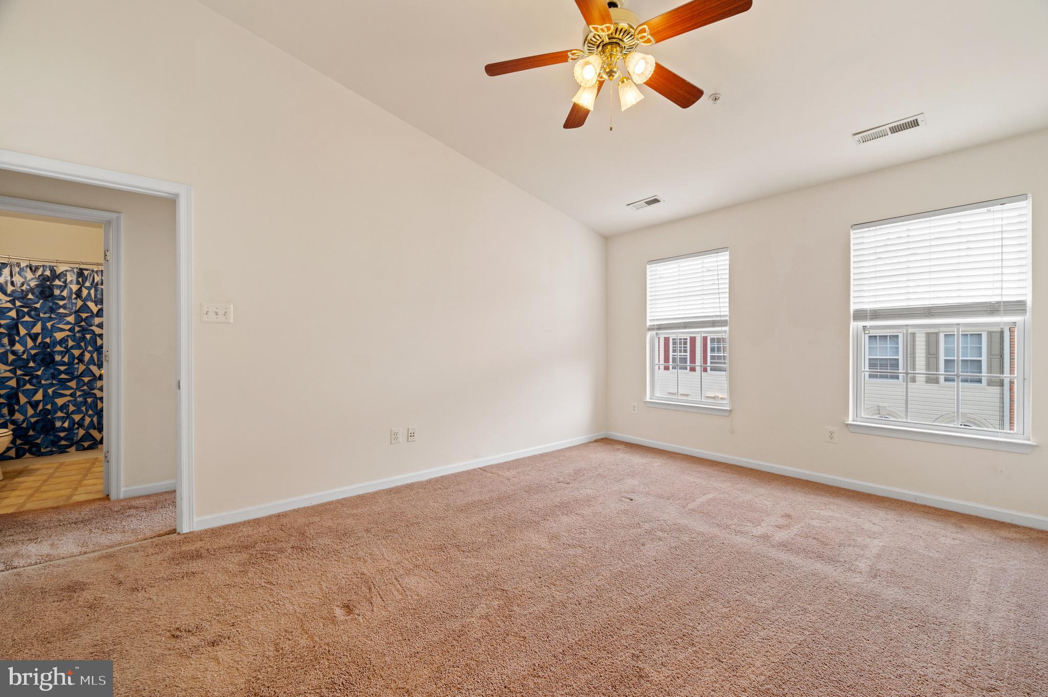 7122 Silverleaf Oak Road, Unit 227 Elkridge, MD 21075 - Photo 27 of 55 an empty room with windows and fan