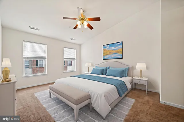 a spacious bedroom with a large bed and a window