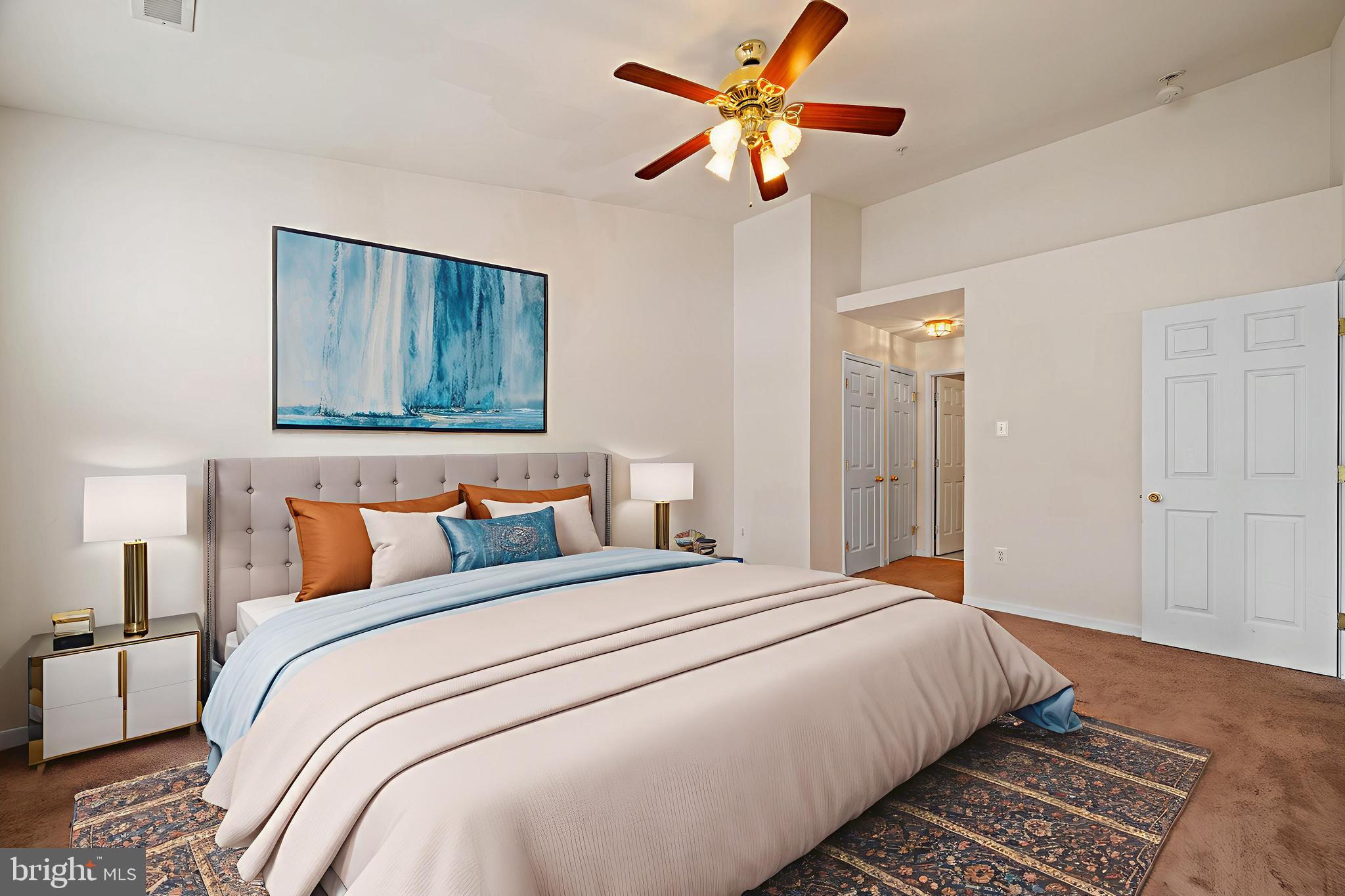 7122 Silverleaf Oak Road, Unit 227 Elkridge, MD 21075 - Photo 5 of 55 a bedroom with bed and a chandelier