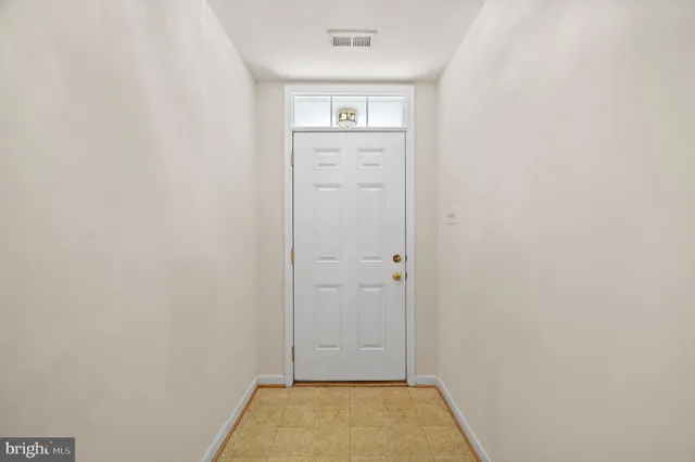a view of a hallway view with staircase