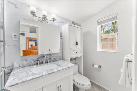 a bathroom with a sink a toilet and a bathtub