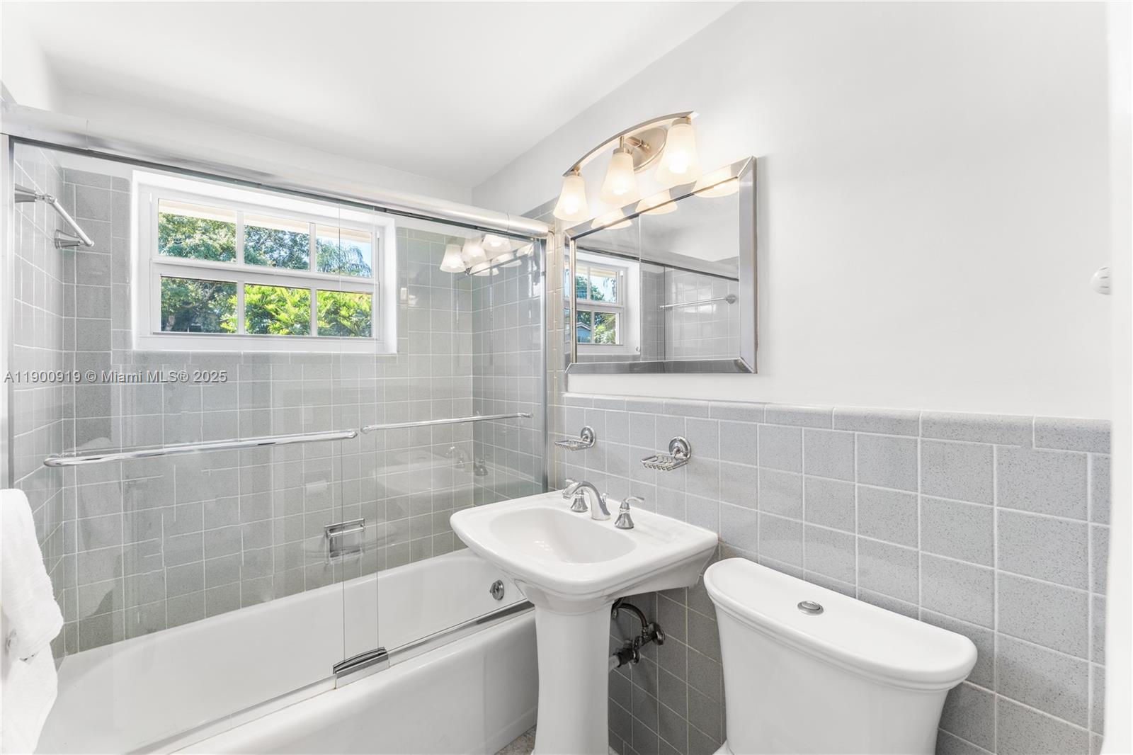 1625 Southwest 5th Court Fort Lauderdale, FL 33312 - Photo 14 of 22 a bathroom with a sink a toilet and a bathtub