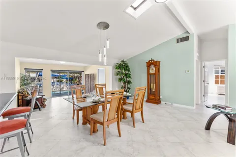 a kitchen with stainless steel appliances granite countertop a sink and cabinets