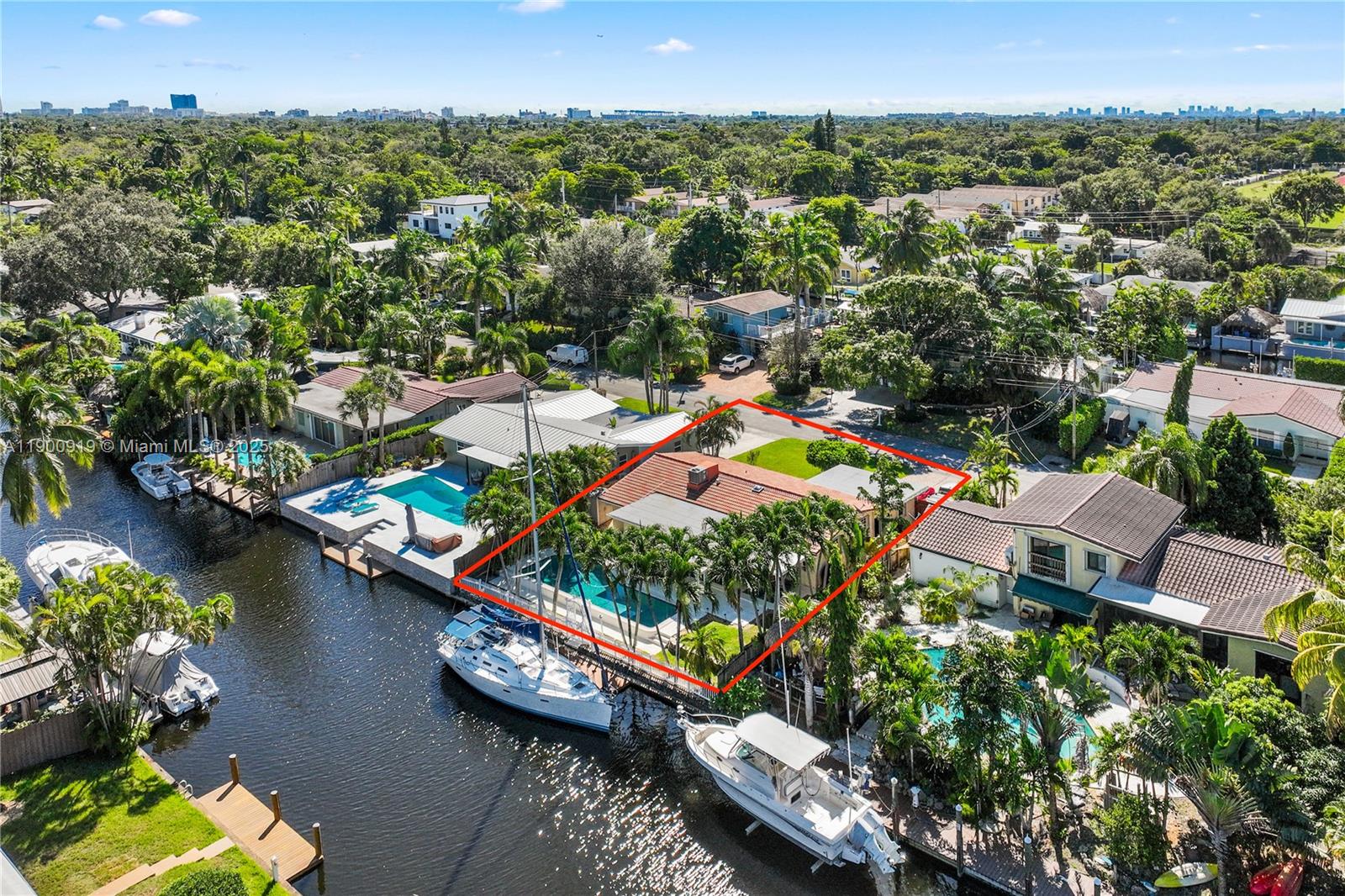 1625 Southwest 5th Court Fort Lauderdale, FL 33312 - Photo 2 of 22 an aerial view of a house with a yard and lake view