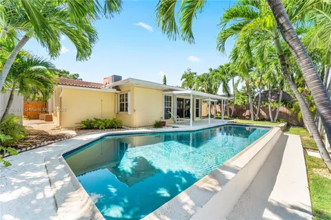 a view of yard with cars and parked car