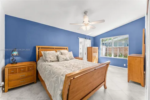 a bathroom with a granite countertop sink toilet a mirror a vanity and shower