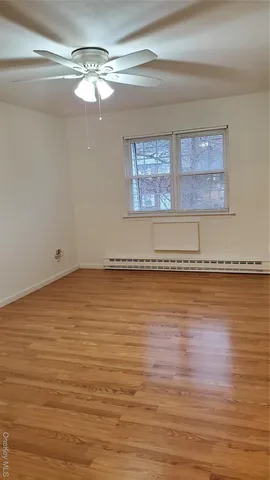 a view of room with wooden floor