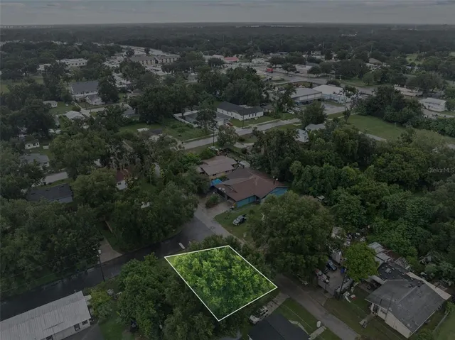 an aerial view of residential house with outdoor space