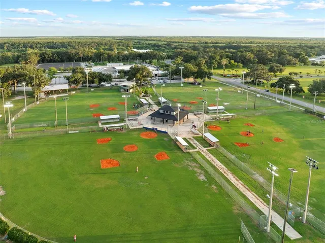 an aerial view of a house with a lake view
